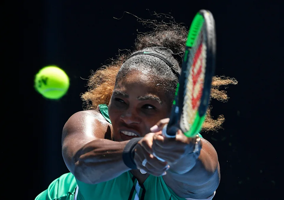 United States' Serena Williams makes a backhand return to Karolina Pliskova of the Czech Republic during their quarterfinal match at the Australian Open tennis championships in Melbourne, Australia, Wednesday, Jan. 23, 2019. (AP Photo/Andy Brownbill)